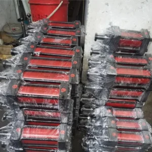 Multiple hydraulic cylinders wrapped in plastic stacked