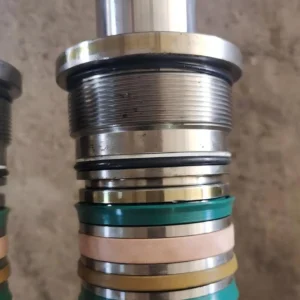 Close-up of piston rod with multiple seals and rings