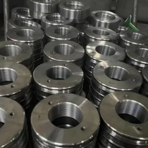 Stacked circular metal mounting parts with central holes visible.