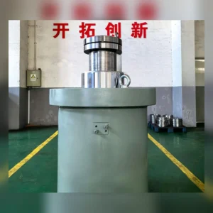 Large industrial cylinder with mounting points on factory floor.