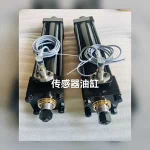 Two sensor cylinders with rods and hoses visible.