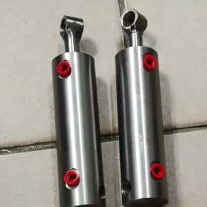 Compact cylinders with red markers on tiled surface