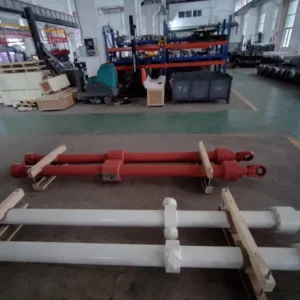 Red and white rods mounted on factory floor
