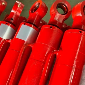 Red industrial cylinders with mounting features