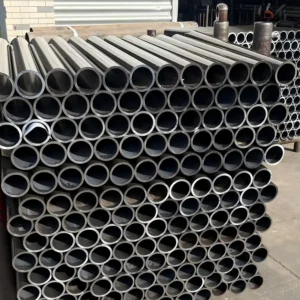 Stacked metal cylinders in outdoor industrial setting